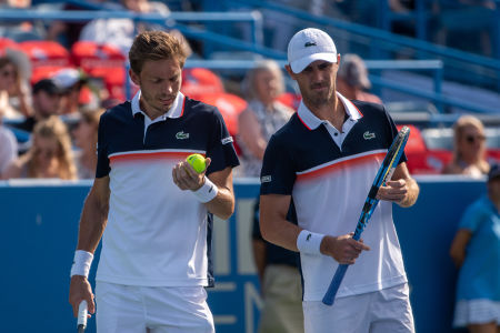 Nicolas Mahut and Edouard Roger-Vasselin talk during their first round doubles match at the Citi Open. — 2019 Citi Open — Citi Open, 2019 Ci