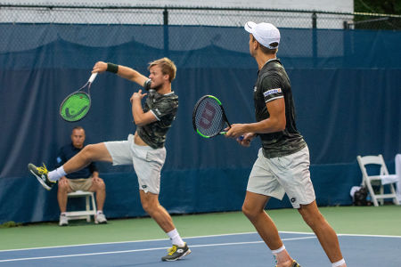 Kevin Krawietz hits an overhead while partner Andreas Mies watches during their first round match at the Citi Open. — 2019 Citi Open — Citi 
