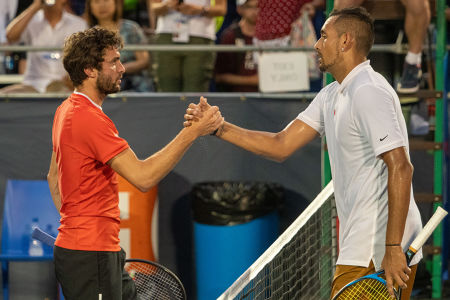 Nick Kyrgios and Gilles Simon exchange pleasantries at the net after the Aussie won their second round Citi Open match. — 2019 Citi Open — C