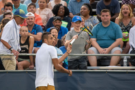 Nick Kyrgios gives away his broken racquet to a lucky fan at the 2019 Citi Open. — 2019 Citi Open — Citi Open, 2019 Citi Open, Tennis