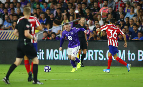 Wayne Rooney prepares for a shot against Athletico Madrid — soccer — MLS, soccer, allstar
