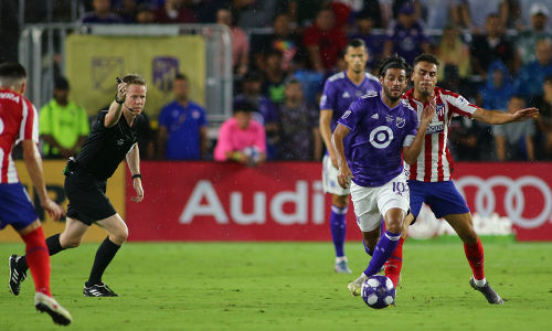 Carlos Vela runs past the Athletico Madrid defender — soccer — MLS, soccer, allstar