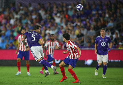 Leandro González Pirez heads the ball against Athletico Madrid — soccer — MLS, soccer, allstar