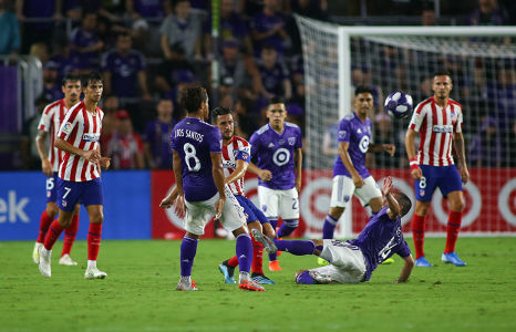 Nicolás Lodeiro slides to stop a shot against Athletico Madrid — soccer — MLS, soccer, allstar