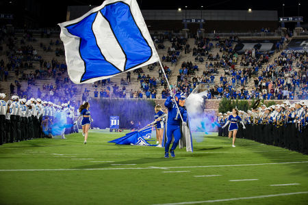 Duke Blue Devil entering field of play with flag — Football — Duke, Football, Pittsburgh